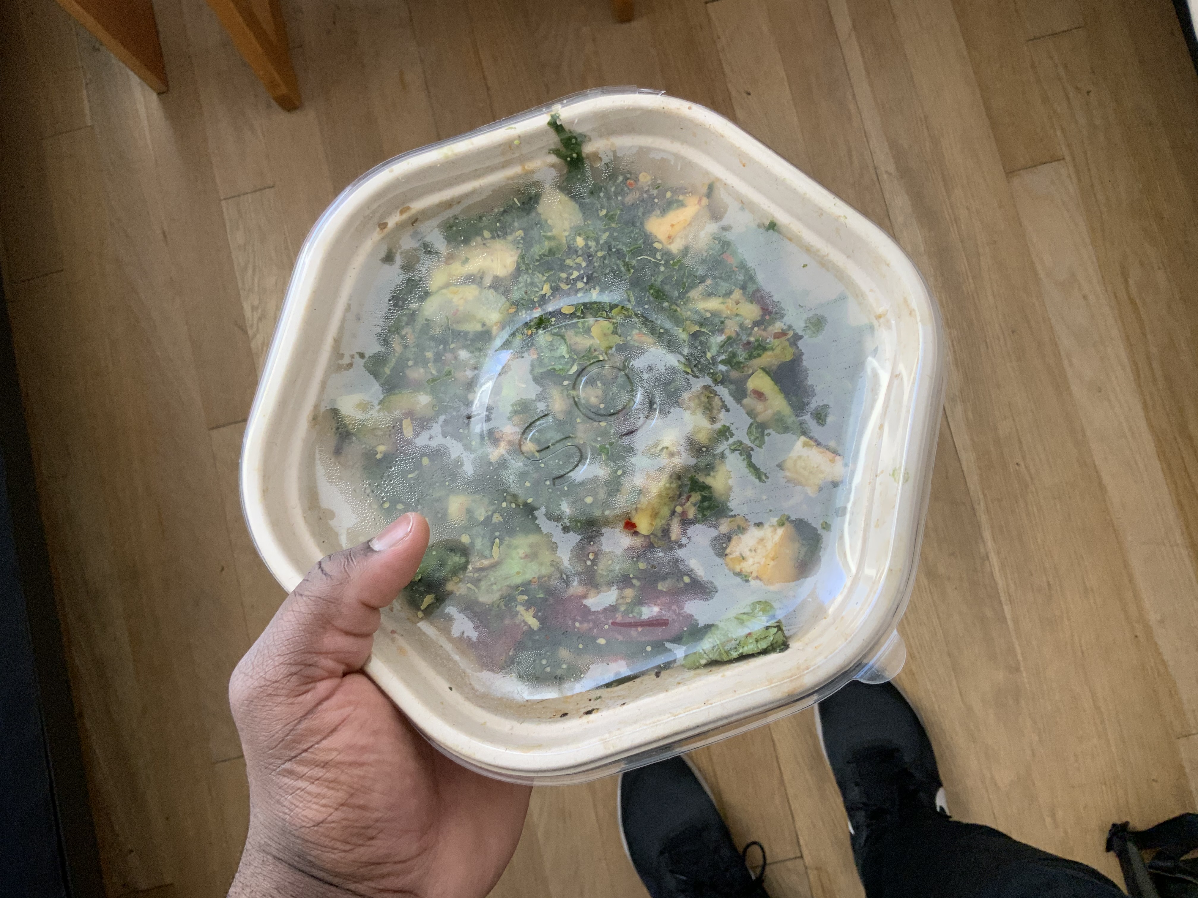 Me holding a bowl of sweetgreen salad